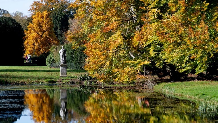 Mirror Pond at Belton with autumnal trees framing it